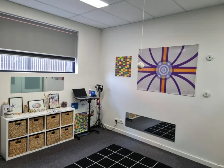 Modern therapy room with decor and equipment.